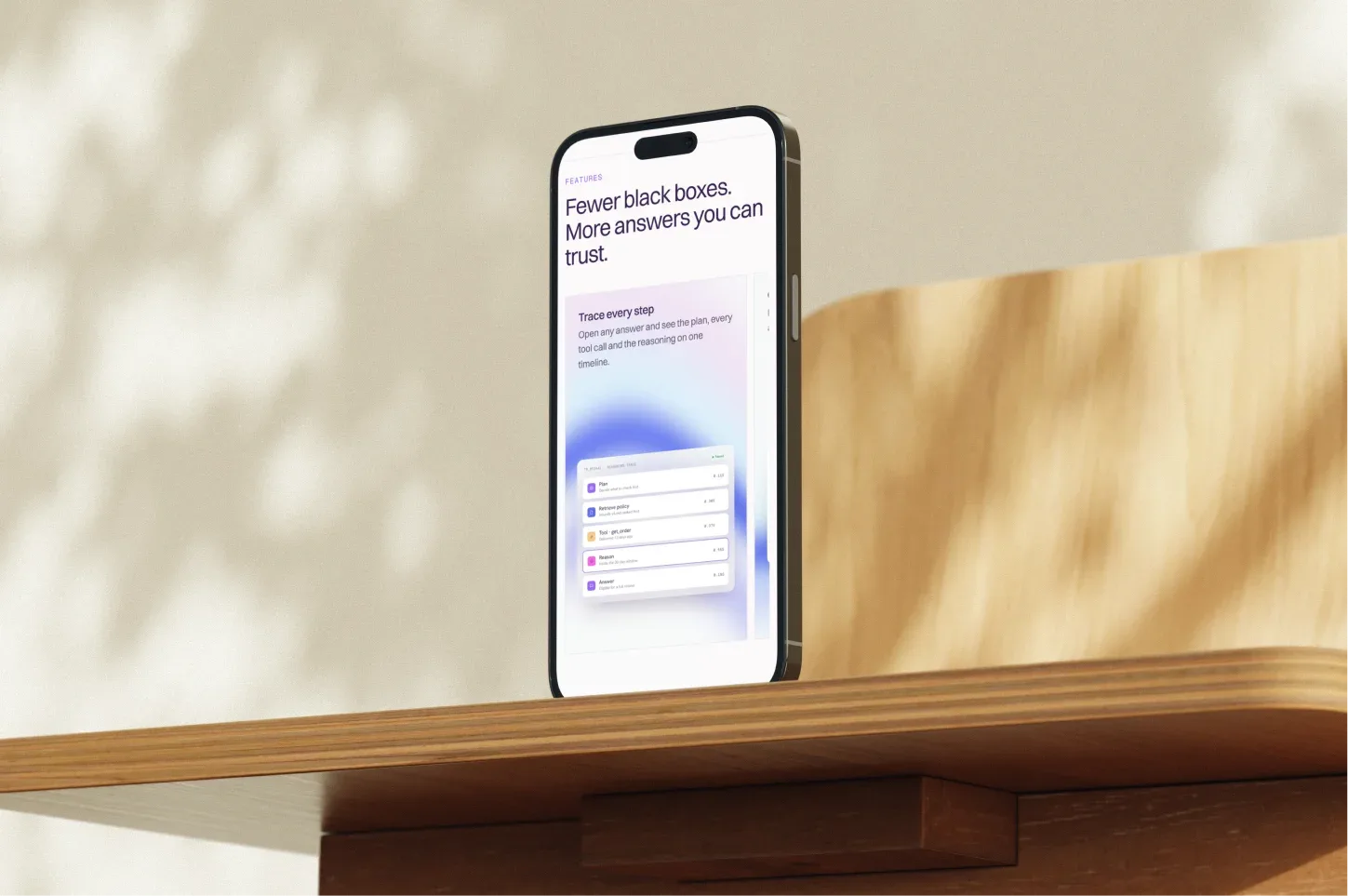 Lumen website on a phone standing on a wooden shelf