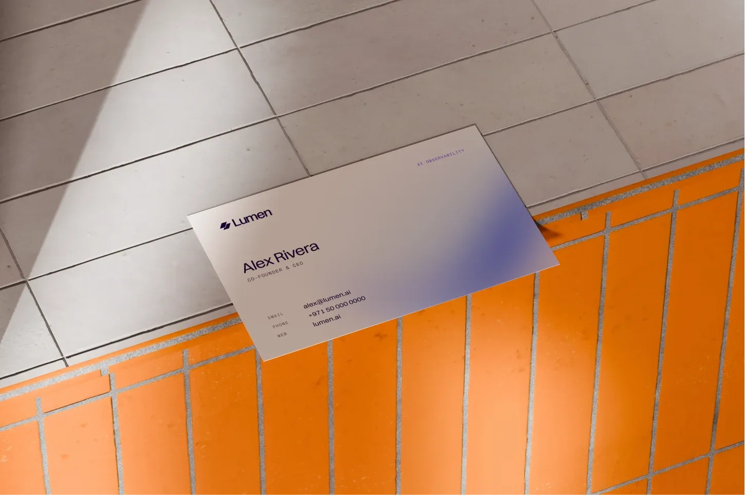 Lumen business card on orange tiles
